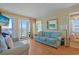 Bright living room with comfortable seating, stylish decor, and balcony access at 9580 Shore Dr. # 311, Myrtle Beach, SC 29572