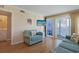 Inviting living area with cozy furnishings, TV, and access to a private balcony at 9580 Shore Dr. # 311, Myrtle Beach, SC 29572