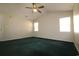 Spacious bedroom with vaulted ceiling, ceiling fan, and natural light at 9972 Conifer Ln., Murrells Inlet, SC 29576