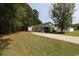 Well-maintained home with a long driveway and spacious yard, surrounded by trees at 9972 Conifer Ln., Murrells Inlet, SC 29576