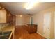 Bright kitchen flows into adjacent living area with hardwood floors and natural light at 9972 Conifer Ln., Murrells Inlet, SC 29576