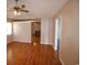 Open living room boasts hardwood floors, neutral walls, and a ceiling fan at 9972 Conifer Ln., Murrells Inlet, SC 29576
