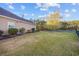 Large backyard with lush green lawn, showcasing the home's private outdoor space and landscaping at 1112 Raven Cliff Ct., Conway, SC 29526