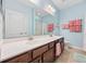 Bathroom featuring a double vanity, a large mirror, and good lighting at 1112 Raven Cliff Ct., Conway, SC 29526