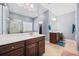 Modern bathroom featuring double vanities, a walk-in shower, and ample natural light at 1112 Raven Cliff Ct., Conway, SC 29526
