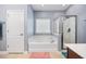 Well-lit bathroom with a soaking tub and a glass-enclosed shower at 1112 Raven Cliff Ct., Conway, SC 29526