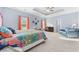 Bright bedroom with colorful accents, including a unique bedspread and curtains at 1112 Raven Cliff Ct., Conway, SC 29526