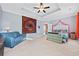 Spacious bedroom featuring a ceiling fan and a comfortable seating area at 1112 Raven Cliff Ct., Conway, SC 29526