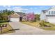 Charming home with a spacious driveway and manicured lawn, creating an inviting exterior view at 1112 Raven Cliff Ct., Conway, SC 29526