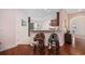 Open kitchen and bar area with granite counters and bar stools, leading into the living room at 1112 Raven Cliff Ct., Conway, SC 29526