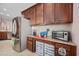 Kitchen counter with stainless steel appliances, granite counters, and under cabinet pull out storage units at 1112 Raven Cliff Ct., Conway, SC 29526
