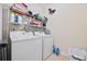 Functional laundry room with washer, dryer, and ample storage space at 1112 Raven Cliff Ct., Conway, SC 29526