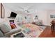 Comfortable living room with a fireplace, ceiling fan, and colorful rug at 1112 Raven Cliff Ct., Conway, SC 29526