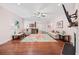 Open concept living space featuring hardwood floors, a ceiling fan, and plenty of natural light at 1112 Raven Cliff Ct., Conway, SC 29526