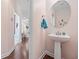 Stylish powder room featuring a pedestal sink and hardwood floors at 1112 Raven Cliff Ct., Conway, SC 29526