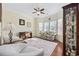 Comfortable sitting room with hardwood floors, natural light, and a ceiling fan at 1112 Raven Cliff Ct., Conway, SC 29526