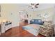 Bright sunroom with hardwood floors and comfortable seating at 1112 Raven Cliff Ct., Conway, SC 29526