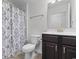 Cozy bathroom featuring a neutral color scheme, a vanity, and a shower with decorative curtain at 1130 Inlet View Dr., North Myrtle Beach, SC 29582