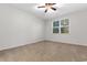 A cozy bedroom with carpeting, a ceiling fan and a view from the window at 1130 Inlet View Dr., North Myrtle Beach, SC 29582