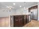 Kitchen island with granite counters, stainless steel appliances, and view of a dining and living area at 1130 Inlet View Dr., North Myrtle Beach, SC 29582