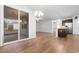 Open-concept living room with wood flooring, modern lighting and access to the outdoor patio at 1130 Inlet View Dr., North Myrtle Beach, SC 29582