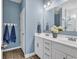 Elegant bathroom featuring double sink vanity, stylish mirror, and modern lighting fixtures at 329 Lake Mist Ct., Longs, SC 29568