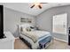 Cozy bedroom with a comfortable bed, stylish decor, and a window providing natural light at 329 Lake Mist Ct., Longs, SC 29568