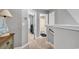 Hallway with access to bathroom, bedrooms, and stairs for convenient home navigation at 329 Lake Mist Ct., Longs, SC 29568