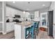 Bright kitchen featuring granite countertops, stainless steel appliances, breakfast bar, and white cabinets at 329 Lake Mist Ct., Longs, SC 29568