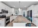 Spacious kitchen featuring stainless steel appliances, granite countertops, and stylish island with seating at 329 Lake Mist Ct., Longs, SC 29568