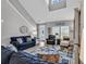 Living room features coastal decor, nautical rug, and vaulted ceiling at 329 Lake Mist Ct., Longs, SC 29568