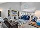 Open concept living area with vaulted ceiling, coastal decor, and view of the kitchen at 329 Lake Mist Ct., Longs, SC 29568