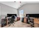 Bright home office space with vaulted ceiling, multiple monitors and desk setups for productivity and style at 329 Lake Mist Ct., Longs, SC 29568