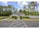 Community Pool House with a small picnic area, parking and bordered by trees at 329 Lake Mist Ct., Longs, SC 29568