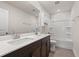 Bright bathroom featuring double sinks, a large mirror, and a shower-tub combination at 4032 Bayhill St., Myrtle Beach, SC 29579