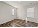 Cozy bedroom with hardwood floors, natural light from two windows and neutral walls at 4032 Bayhill St., Myrtle Beach, SC 29579