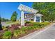 Welcoming entrance sign to Clear Pond, set amidst lush landscaping and manicured gardens at 4032 Bayhill St., Myrtle Beach, SC 29579