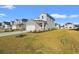 New two-story home with stone accents, professional landscaping, and green lawn at 4032 Bayhill St., Myrtle Beach, SC 29579
