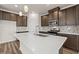 Modern kitchen boasts stainless steel appliances, quartz countertops, and pendant lighting at 4032 Bayhill St., Myrtle Beach, SC 29579