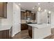 Modern kitchen boasts stainless steel appliances, quartz countertops, and pendant lighting at 4032 Bayhill St., Myrtle Beach, SC 29579