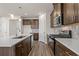 Modern kitchen features stainless steel appliances, quartz countertops, and dark wood cabinets at 4032 Bayhill St., Myrtle Beach, SC 29579