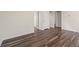 Spacious living room featuring hardwood floors, neutral paint, and multiple doors for easy access at 4032 Bayhill St., Myrtle Beach, SC 29579