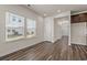Bright and airy living room features large windows, hardwood floors, and neutral paint at 4032 Bayhill St., Myrtle Beach, SC 29579