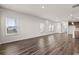 Spacious living room with hardwood floors and multiple windows providing natural light at 4032 Bayhill St., Myrtle Beach, SC 29579