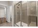 Modern shower with grey tiling and clear glass door at 4032 Bayhill St., Myrtle Beach, SC 29579
