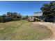 Expansive backyard featuring a well-maintained lawn, a wooden deck and access to the waterway at 613 23Rd Ave. N, North Myrtle Beach, SC 29582