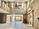 Open-concept living room with high ceilings, wood paneled walls and lots of natural light at 613 23Rd Ave. N, North Myrtle Beach, SC 29582