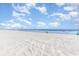 Expansive sandy beach with beach chairs and ocean view under a cloudy blue sky at 707 S Ocean Blvd. # 602, North Myrtle Beach, SC 29582
