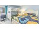 Cozy bedroom features bunk beds with vibrant sunflower-themed bedding and a coastal color palette at 707 S Ocean Blvd. # 602, North Myrtle Beach, SC 29582