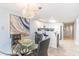 Dining area with a glass table and view into kitchen and hallway at 707 S Ocean Blvd. # 602, North Myrtle Beach, SC 29582